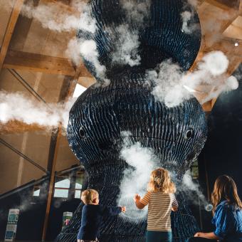 Family looking at Infinity Blue sculpture